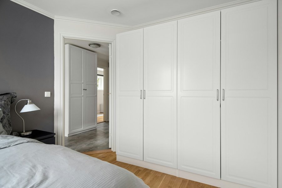 Fitted wardrobes built into an apartment bedroom