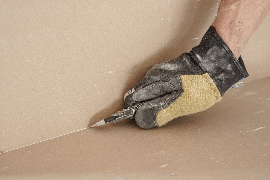 Skim coat being worked into an internal corner